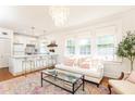 Open-concept living space with modern kitchen, cozy seating, and abundant natural light at 824 Greenwood Ne Ave # 9, Atlanta, GA 30306
