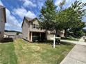 Charming home with a well-manicured lawn and professional real estate sign at 3522 Fallen Oak Dr, Buford, GA 30519