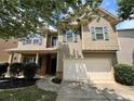 Attractive two-story home featuring a two-car garage, and inviting front porch at 3522 Fallen Oak Dr, Buford, GA 30519