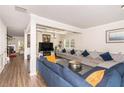 Spacious living room with coffered ceiling, hardwood floors, and elegant decor at 10137 Cormac St, Jonesboro, GA 30238