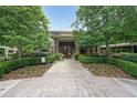 Entrance to building at 2100 Clairmont with a brick walkway, landscaping, and brick facade at 1800 Clairmont Lk # 313, Decatur, GA 30033