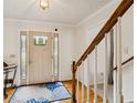 Bright foyer featuring hardwood floors, a decorative rug and a staircase with white risers at 1850 Thomas Ne Dr, Marietta, GA 30066