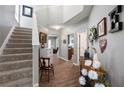Welcoming entryway with staircase, stylish decor, and wood-look flooring at 303 Barberry Pl, Canton, GA 30114