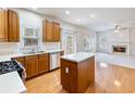 Bright kitchen with stainless steel appliances, an island and a gas cooktop stove at 3515 Mcclure Woods Dr, Duluth, GA 30096