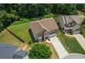 An aerial view of a beautiful home surrounded by lush greenery and well-maintained lawns at 3547 Edenridge Ct, Buford, GA 30519