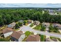 An aerial view showcases a neighborhood with tree-lined streets and well-manicured lawns at 3547 Edenridge Ct, Buford, GA 30519