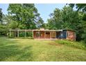 Expansive lawn and covered patio enhance the curb appeal of this brick home at 3861 Foxford Dr, Atlanta, GA 30340