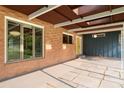 Inviting covered patio with brick facade and outdoor living space at 3861 Foxford Dr, Atlanta, GA 30340