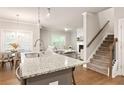 Modern open-concept kitchen, adjacent dining area and living room at 1603 Glen Ivy, Marietta, GA 30062