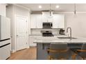 Modern kitchen featuring stainless steel appliances and granite countertops at 1603 Glen Ivy, Marietta, GA 30062