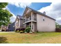 Attractive two-story home featuring a well-maintained lawn, and a second story balcony at 3631 Guinevere Trace Trce, Douglasville, GA 30135