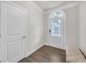 Bright foyer featuring a bench, modern door and lovely flooring at 2530 Clairebrooke Bend, Atlanta, GA 30341