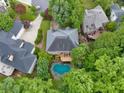 Stunning aerial view of the home with private pool and surrounding greenery at 1488 Lachona Ne Ct, Atlanta, GA 30329