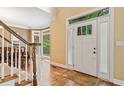 Inviting foyer with hardwood floors and a staircase, filled with natural light at 1488 Lachona Ne Ct, Atlanta, GA 30329