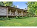 Inviting porch with rustic wood finish, offering a relaxing outdoor space at 267 Firecreek Rdg, Lawrenceville, GA 30046
