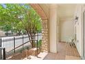 Charming porch with brick flooring, stone accents, and a view of a tree-lined street at 625 Piedmont Ne Ave # 105, Atlanta, GA 30308