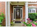 Inviting front entrance featuring a decorative door, brick columns and a 'Welcome' sign at , Atlanta, GA 30360