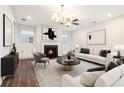 Modern living room with fireplace, recessed lighting and stylish decor at 3514 Ambassador Aly, Scottdale, GA 30079