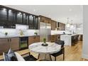 Modern kitchen with stainless steel appliances, marble countertops, and hardwood floors at 560 Morgan Ne St, Atlanta, GA 30308