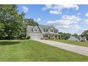 Spacious home features an attached two-car garage and long driveway at 105 Pine Valley Ct, Hiram, GA 30141