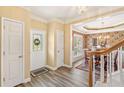 Inviting foyer with hardwood floors that leads into a formal dining area at 105 Pine Valley Ct, Hiram, GA 30141