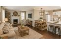 Inviting living room with wood floors, fireplace, ample seating, and modern decor accents at 15 Harlan Rd, Atlanta, GA 30311