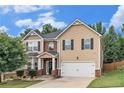 Charming two-story home featuring a two-car garage and well-manicured front lawn at 316 Sierra Ct, Mcdonough, GA 30253
