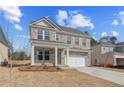 Comfortable two-story brick home featuring a two-car garage and a covered front porch at 619 Leafy Branch Way, Mcdonough, GA 30253