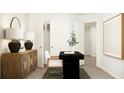 Office features a black desk, wooden console, and neutral walls at 813 Atkins Ln, Woodstock, GA 30188