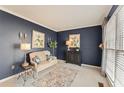 Cozy living room with blue walls, comfortable seating, and natural light at 154 Hunters Trl, Dallas, GA 30157