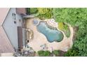 Backyard pool and spa with ample space for entertaining and relaxing by the water at 103 Millstone Way, Canton, GA 30115
