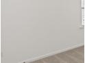 Close up on a white wall and grey carpet, partially showing a window at 1204 Arnhem Dr, Hampton, GA 30228