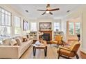 Bright living room featuring a fireplace, built-in shelving, and many windows for natural light at 2056 Hosea L Williams Ne Dr, Atlanta, GA 30317