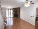 Inviting living room with hardwood floors and a beautiful stone fireplace at 6658 Ramsgate Way, Norcross, GA 30093