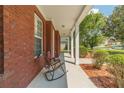 Relaxing front porch with rocking chair and views of the yard and neighborhood at 2479 Mitford Ct, Dacula, GA 30019