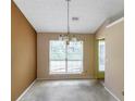Dining room featuring a decorative chandelier and a window view to the yard at 9550 Canvasback Ct, Jonesboro, GA 30238