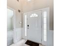 Bright entryway featuring a white door with glass accents and neutral-toned walls at 1909 Sawgrass Dr, Hampton, GA 30228