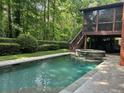 Backyard pool area with a hot tub feature and screened in patio at 1984 Mendenhall Cir, Atlanta, GA 30341