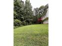 Expansive backyard with lush green grass, providing ample space for outdoor activities and enjoyment at 645 Robin Rd, Covington, GA 30016