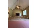 Inviting living room with a cozy fireplace and vaulted ceilings, creating a warm and open atmosphere at 645 Robin Rd, Covington, GA 30016