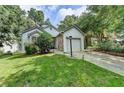 Charming single-story home featuring a well-maintained lawn, attached garage, and inviting curb appeal at 1133 Capital Club Ne Cir, Brookhaven, GA 30319