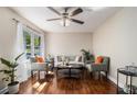 Cozy living area with stylish furniture and a large window at 863 Needle Rock Dr, Stonecrest, GA 30083