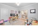 Bright home office with hardwood floors, natural light and modern decor at 306 Coppergate Ct, Holly Springs, GA 30115