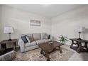 Cozy living room with comfortable seating, lamps, and decorative coffee table at 397 Victory Ln Ln, Locust Grove, GA 30248