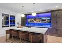 Wet bar featuring custom cabinets, a quartz countertop, and modern pendant lighting at 4927 Slaton Dr, Acworth, GA 30101