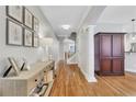 Elegant entryway with hardwood floors, decorative console table, and classic architectural details at 620 Neel Reid Dr, Roswell, GA 30075