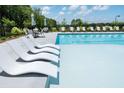 Lounge chairs sit next to a community pool at 5330 Keepsake Court, Cumming, GA 30040