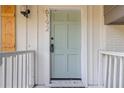 Inviting front entrance features a freshly painted door, shutters, updated hardware and fixtures at 6192 Holiday Blvd, Forest Park, GA 30297