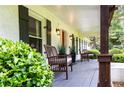 Inviting front porch with seating, providing a cozy outdoor space and charming details at 3548 Liberty Ln, Marietta, GA 30062
