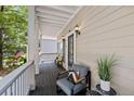 Inviting front porch with comfortable seating area, perfect for relaxing and enjoying the outdoors at 944 Herndon Nw St, Atlanta, GA 30318